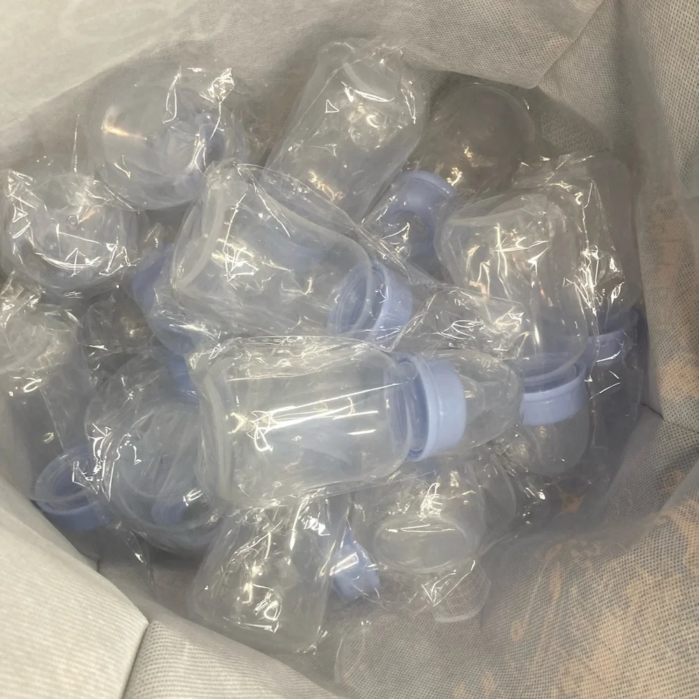 Set of 23 Clear Baby Bottles Blue Caps Baby Shower Party favors. 5 1/2 x2 inches